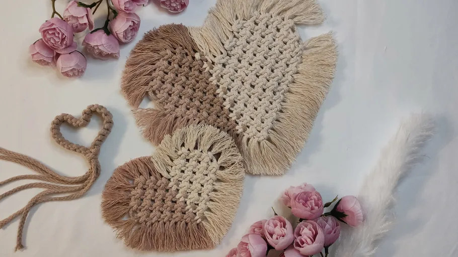 Woven heart ornaments with pink roses.