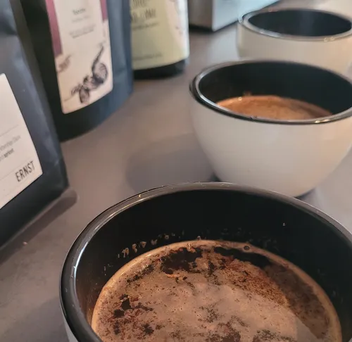 Three cups of coffee on a table.