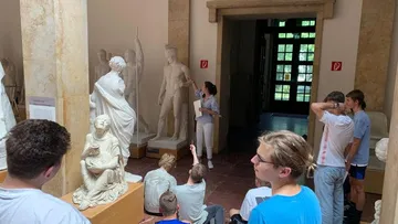 Sculpture in the museum, group tour about ancient art.