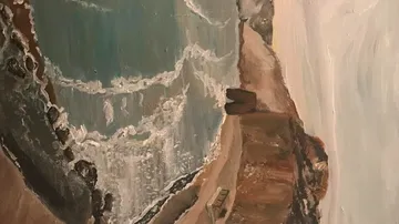 Coast with waves hitting cliffs, picturesque background.