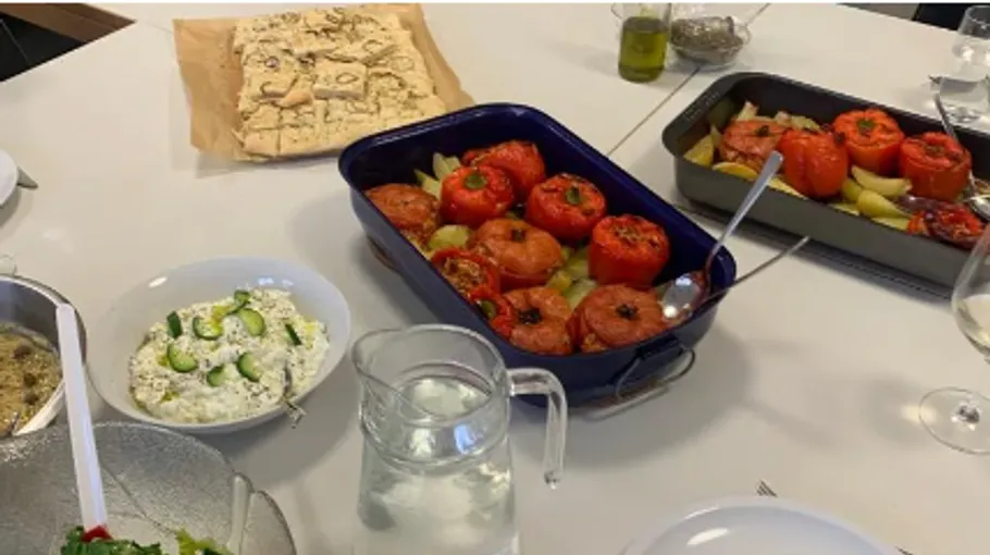Meal dishes on a table served with fresh water.