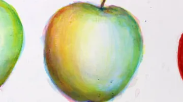 Three apples stand side by side on a white background.