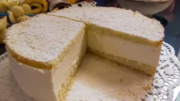 A cake with snow-white filling, sliced.