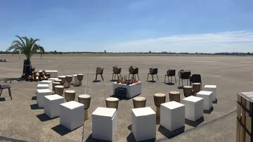 Round arrangement of musical instruments in open space.