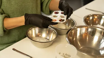 Ingredients are prepared in bowls while cooking.