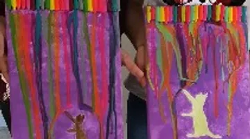 Two painted canvases with colorful, melting wax painters.