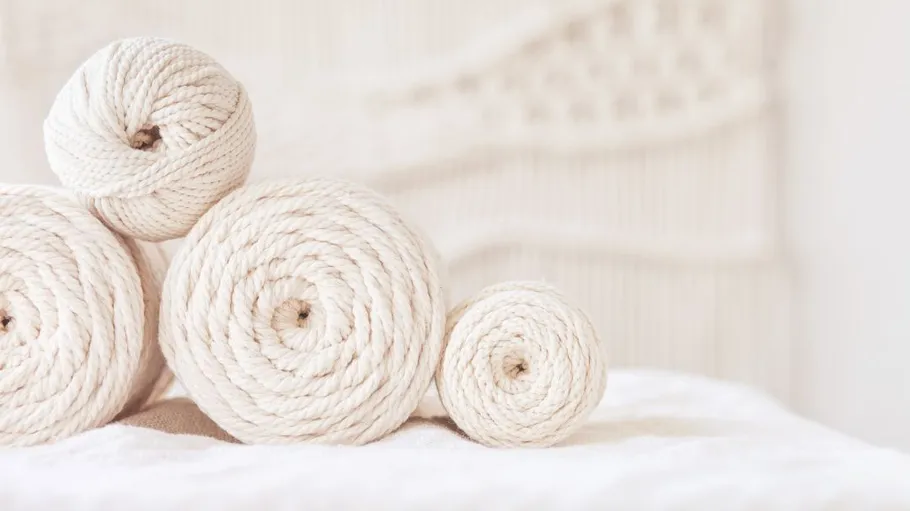 Two to four bundles of rolls lie on a bright surface.