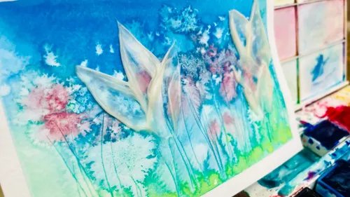 Colourful flowers in watercolor, creatively presented on white paper.