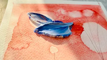 Blue brushstroke on red, watercolor background.