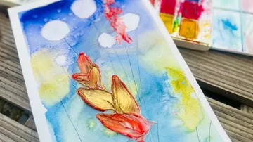 Watercolor painting with colorful flowers and clouds in the background.