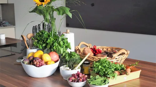 Various fresh foods arranged on a kitchen table.