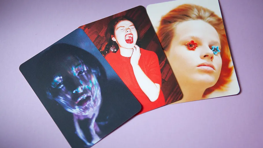 Three cards show emotional portraits on a purple background.