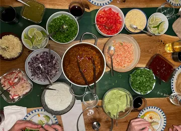 Table full of various ingredients for a banquet.
