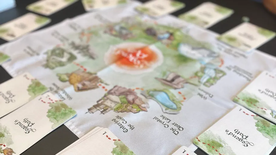 Game board with cards laid out on a table.