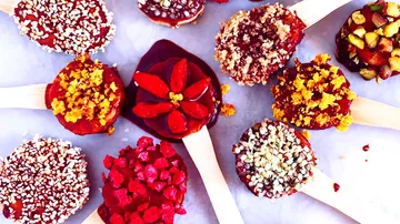 Popsicles decorated with various toppings presented