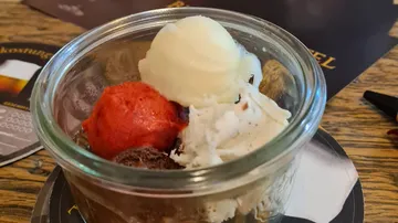 Ice cream in a glass with different varieties. Enjoyment in the restaurant.
