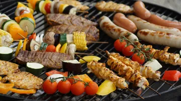 Grill with meat and vegetables roast outdoors.