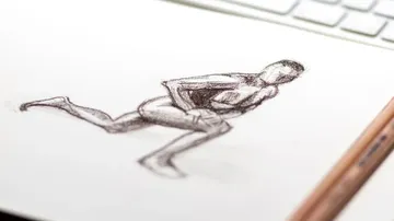 Human figure sits upright and holds his knee.