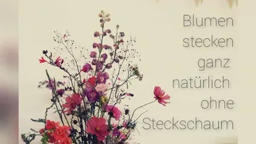 Colourful flowers arranged, stand naturally without a sponge. Text: `Flowers stick naturally without a sponge. `