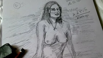 A naked woman stands on a piece of paper, drawn.