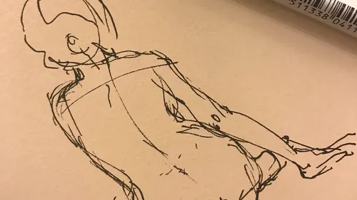 Sketch of a figure with a rotating upper body on paper.