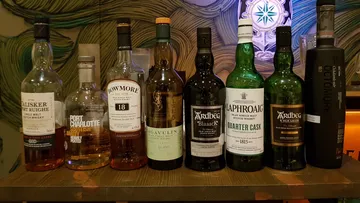 Set of whiskey bottles on a table, attractively presented