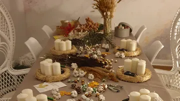 table with candles, decorated for a celebration or celebration.