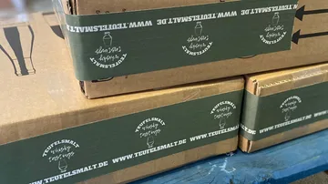 Cardboard packages with whiskey tasting labels are piling up.