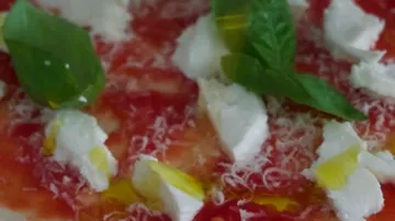 Tomato salad with mozzarella, basil and olive oil.
