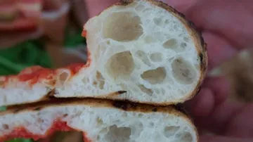 A piece of bread shows sliced, airy crumb and crust.