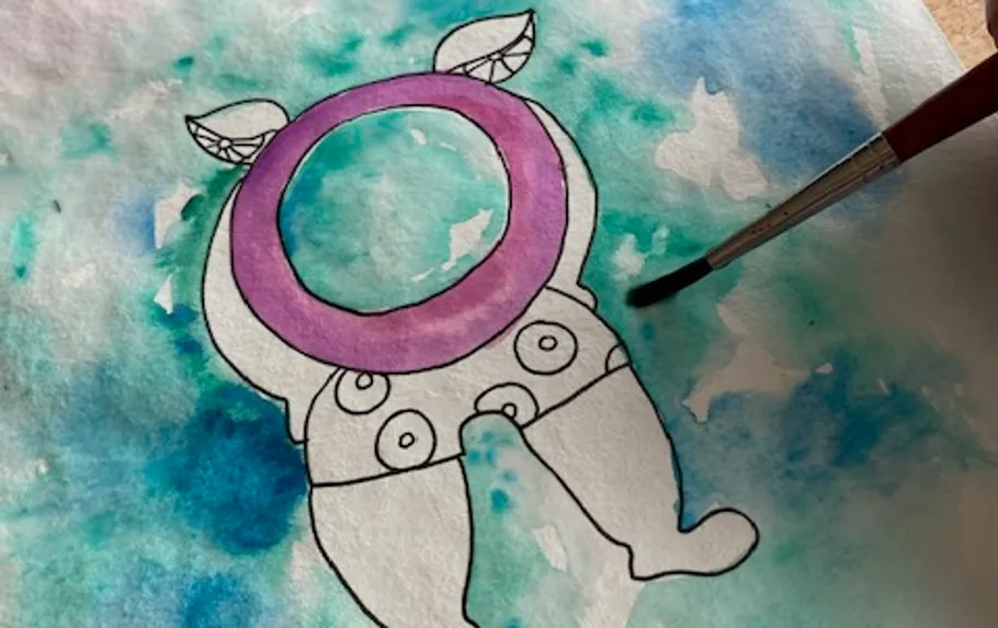 Colourful paintings are painted with a brush on paper.