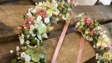 Flower wreath lying on wood, decorative and colorful.