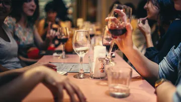 Glasses with drinks on a table, social gatherings.