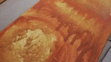 Canvas with orange color gradients, irregular patterns.