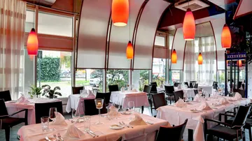 Elegant tables with an illuminated atmosphere in a restaurant.