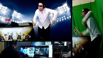 A man dances in front of a screen with headphones on.