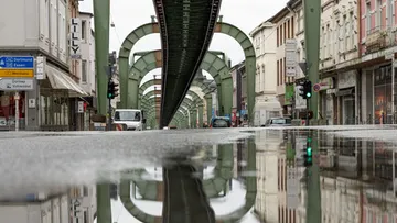 A railway underpass in the city reflects water quality.