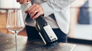 Glass is ready while the bottle is being opened.