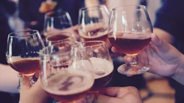 Six glasses toast to celebrate a celebration.