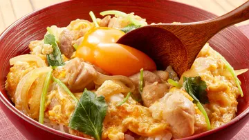 Bowl of rice stuffed with chicken and egg yolk.