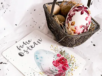 Easter basket with colorful eggs and a card