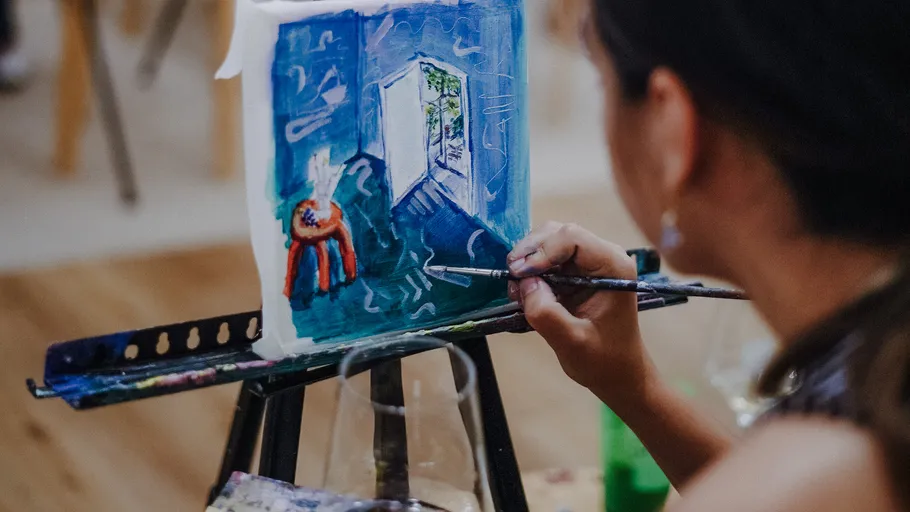 Artist paints a picture of an open door.