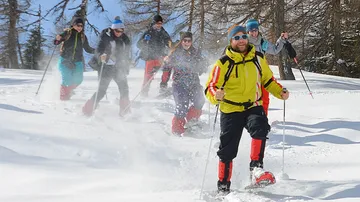 Group of people hiking in snow.