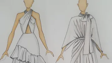 Two design sketches of elegant evening dresses on paper.