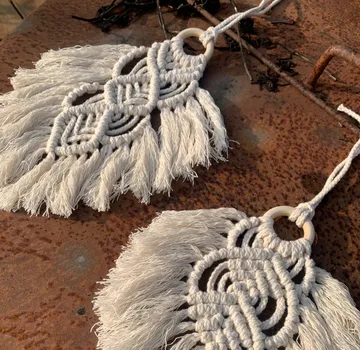 Two macrame pendants on small wooden rings