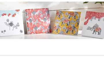 Colourful cards decorated with animals on a table