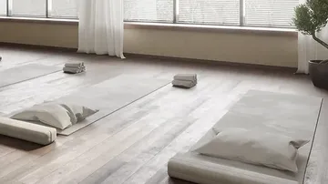 Floor mats lie in a bright, quiet room.