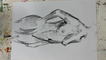 Body outline, drawn on paper, with free posture.