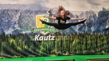 Kautz jumping area, person jumping in the air, mountain landscape.