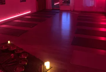 Mats in a lighted room, ready for yoga session
